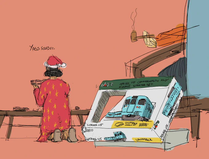 Tzipora playing with a trainset on Christmas morning